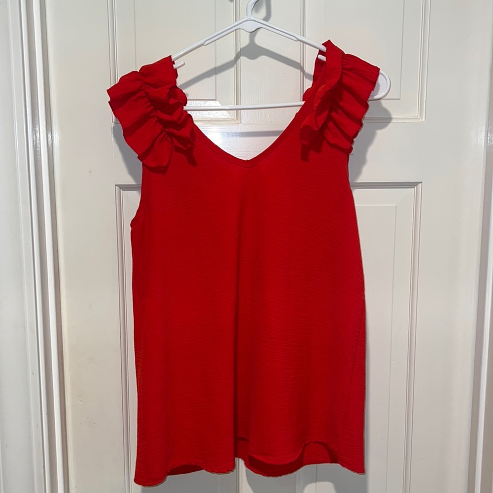 Very cute blouse with rifle sleeves. Size small